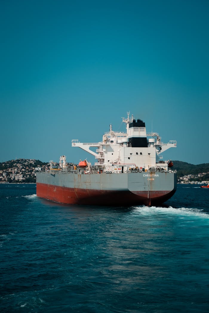 A large oil tanker moves through the ocean, showcasing international transportation and logistics.